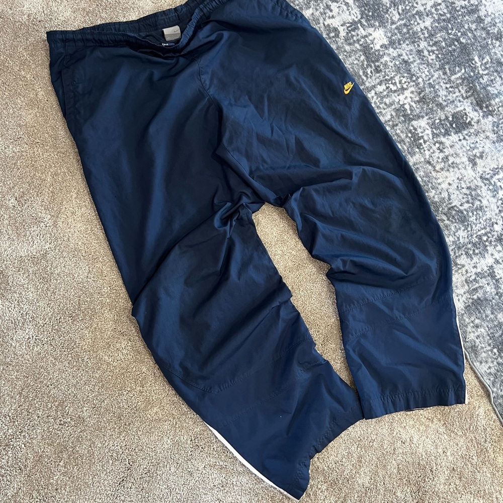 Nike Men's Dark Blue Joggers with Yellow Logo
